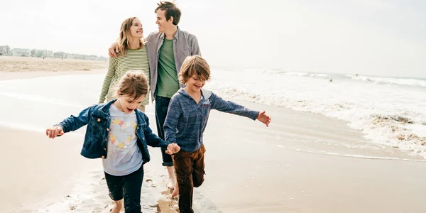 Family walking together on a beach