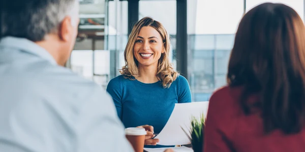 Woman smiling in a meeting