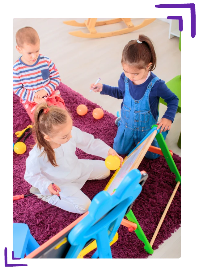Children playing together in a classroom
